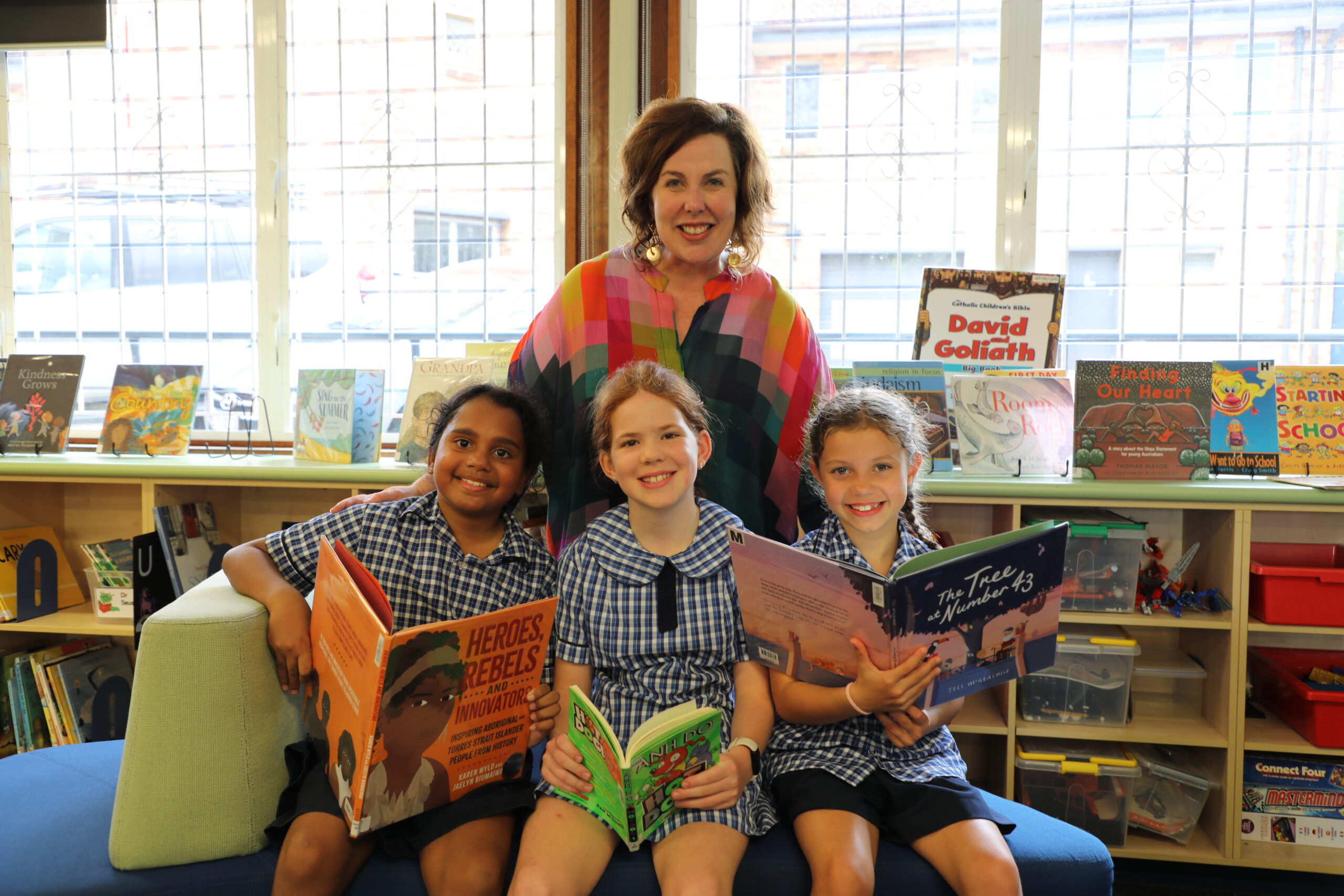 Brisbane Catholic Education - person walking with school kids