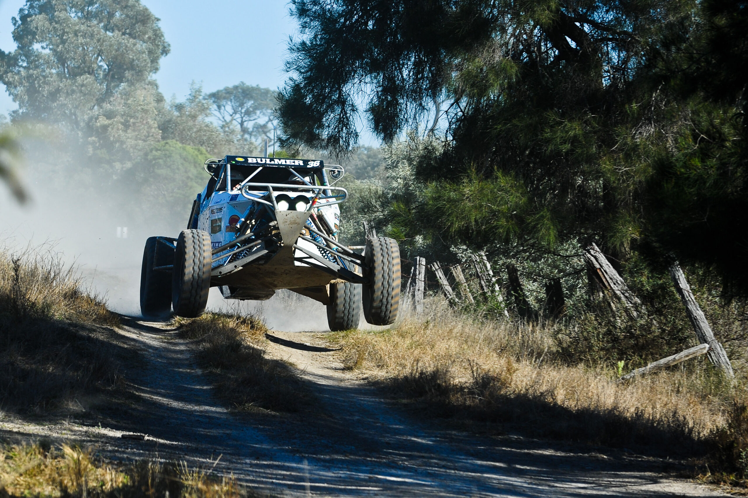 Rally car racing down track