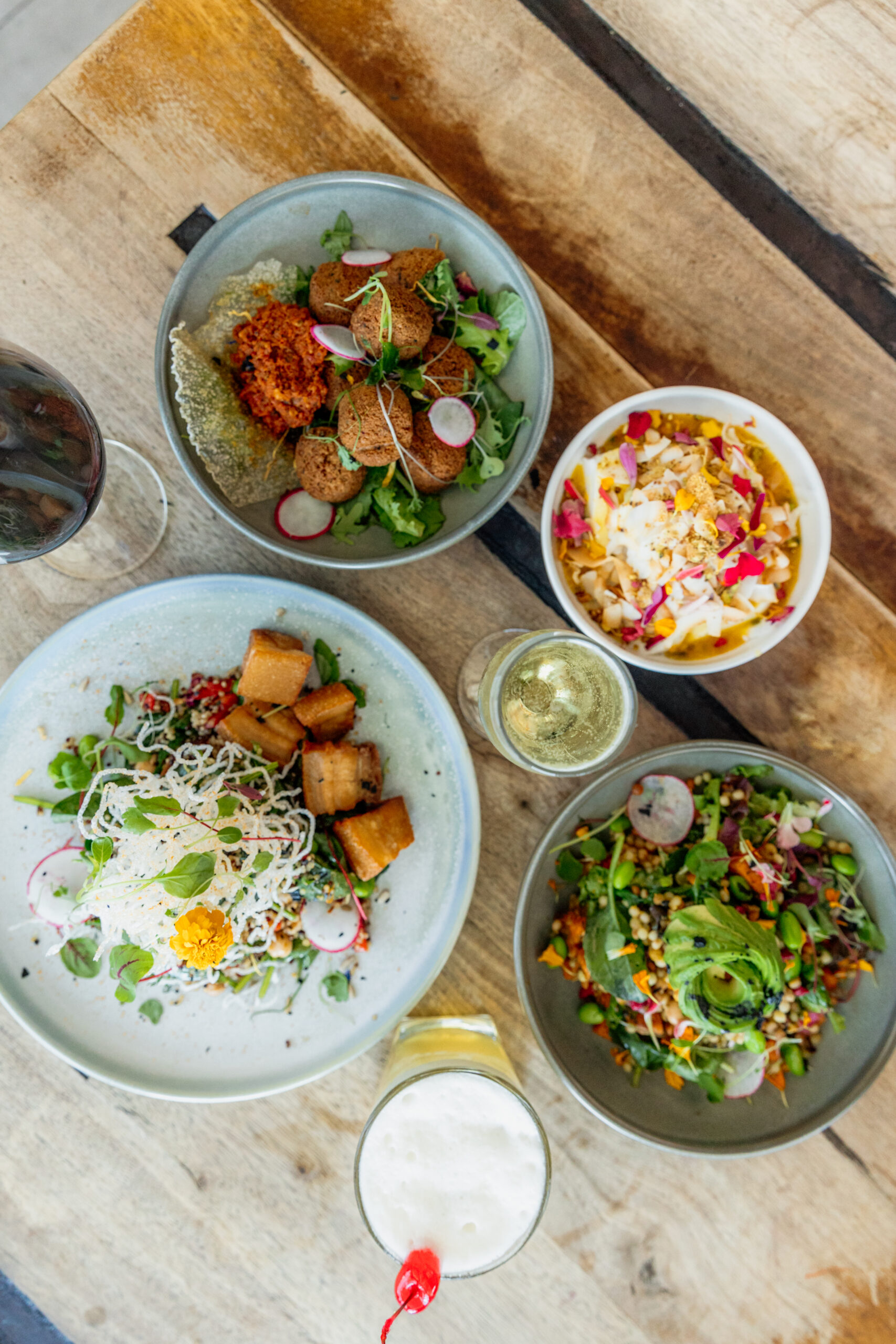 A table with plates of food and drinks