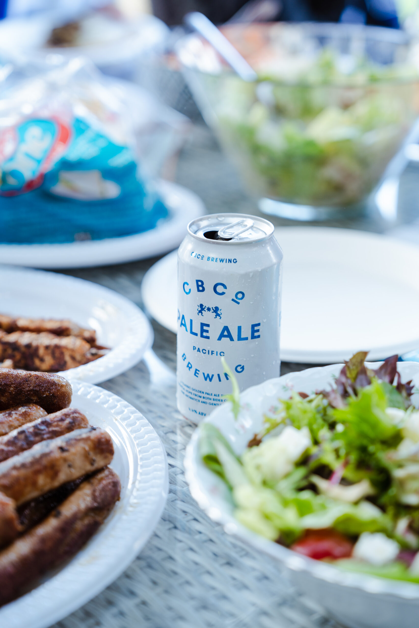 CBCo Beer on a table with food