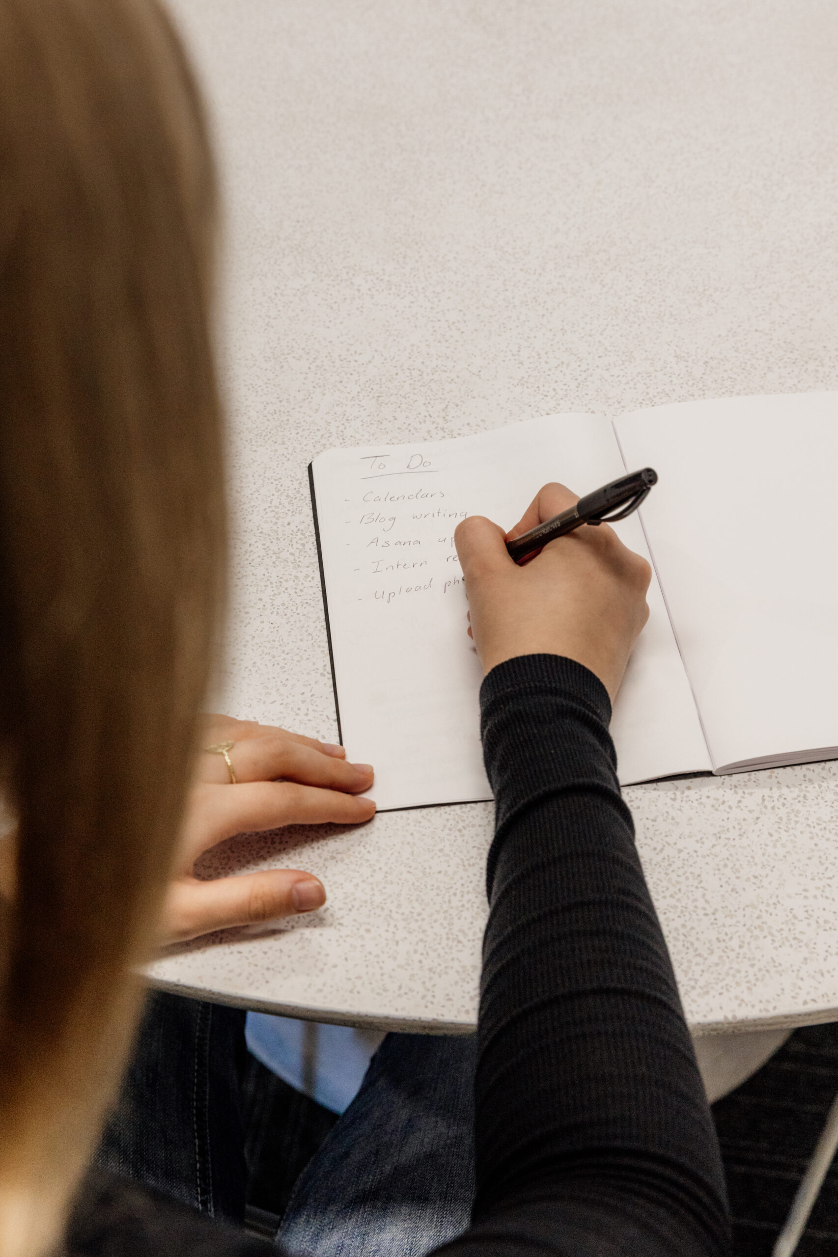 Women writing in her note book