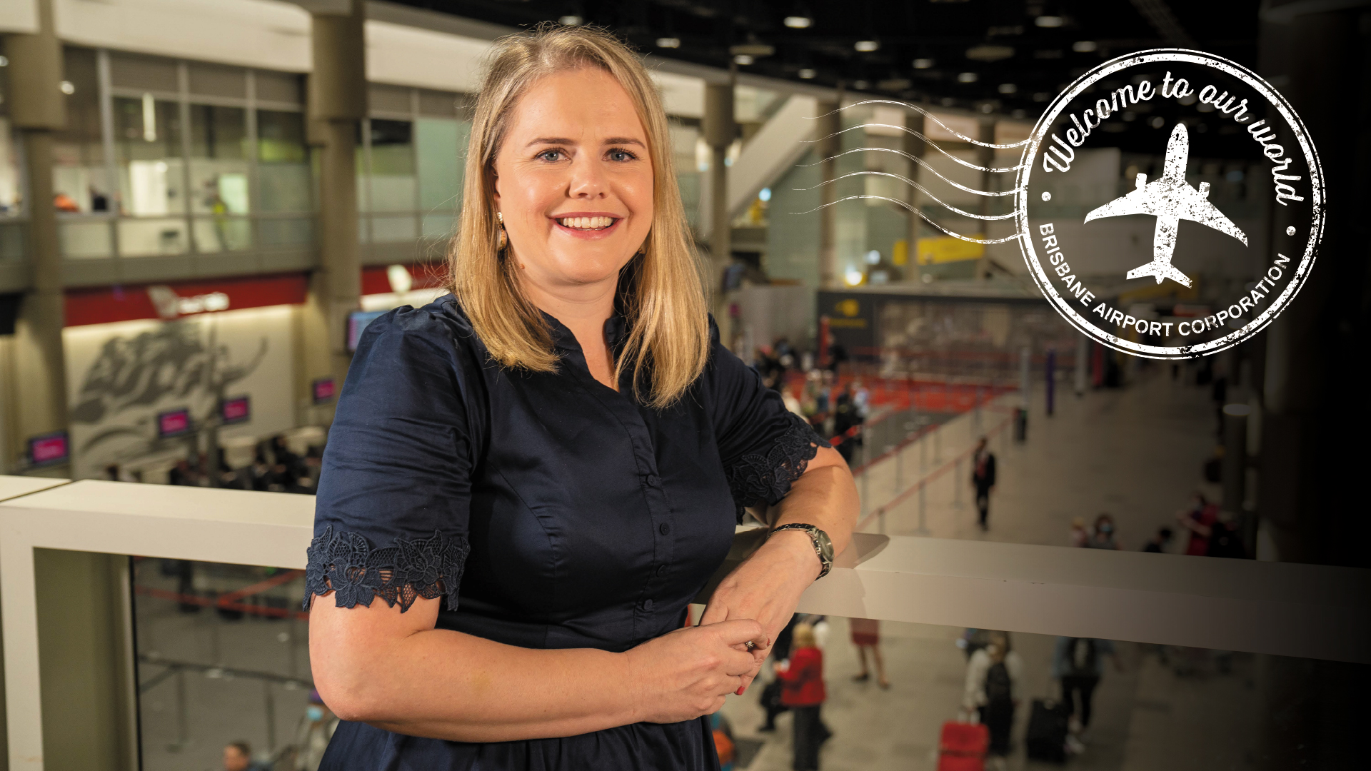 Woman smiling with campaign device wording &#039;Welcome to our world&#039;